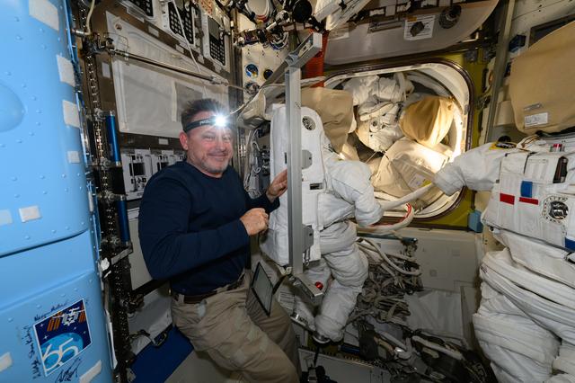 NASA image: Astronaut Butch Wilmore performs spacesuit maintenance