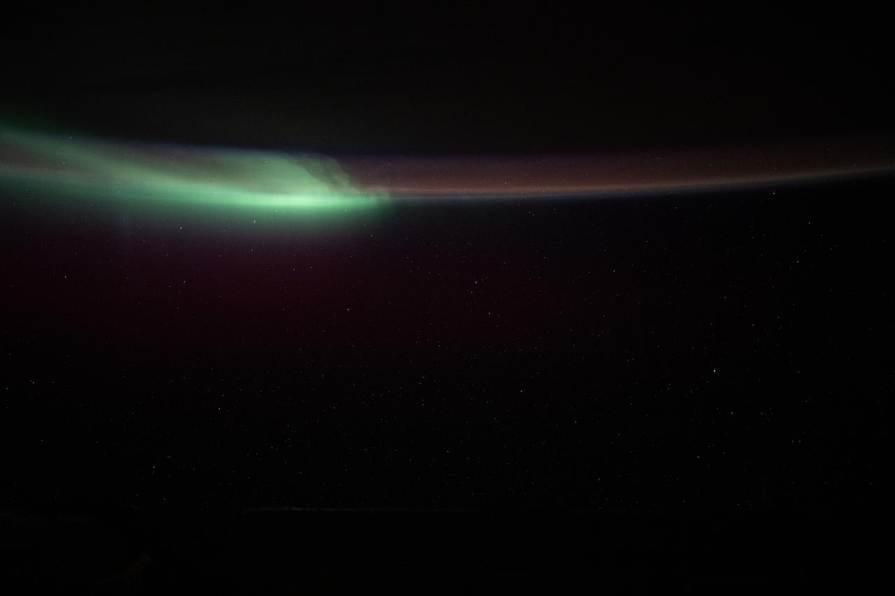 iss072e023504 (Sept. 28, 2024) -- As the International Space Station soared 271 miles above the Indian Ocean during orbital nighttime, a vibrant green aurora begins to fold through Earth's atmosphere.