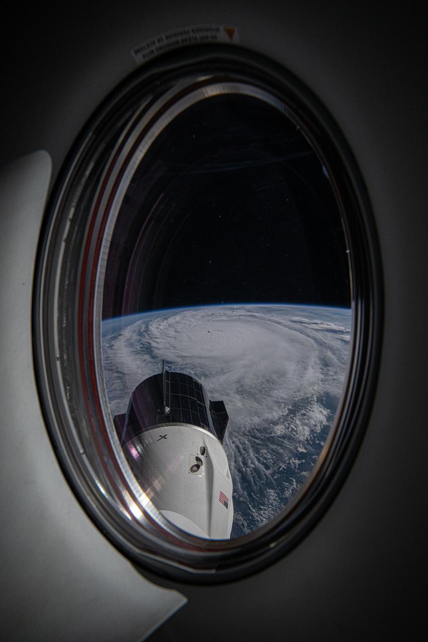 iss072e029590_alt (Oct. 8, 2024) --- Hurricane Milton is pictured as a category 4 storm in the Gulf of Mexico nearing the coast of Florida in this photograph from the International Space Station as it orbited 257 miles above. The SpaceX Dragon Freedom spacecraft is also pictured from a window on the Dragon Endeavour spacecraft. Credit: NASA/Matthew Dominick