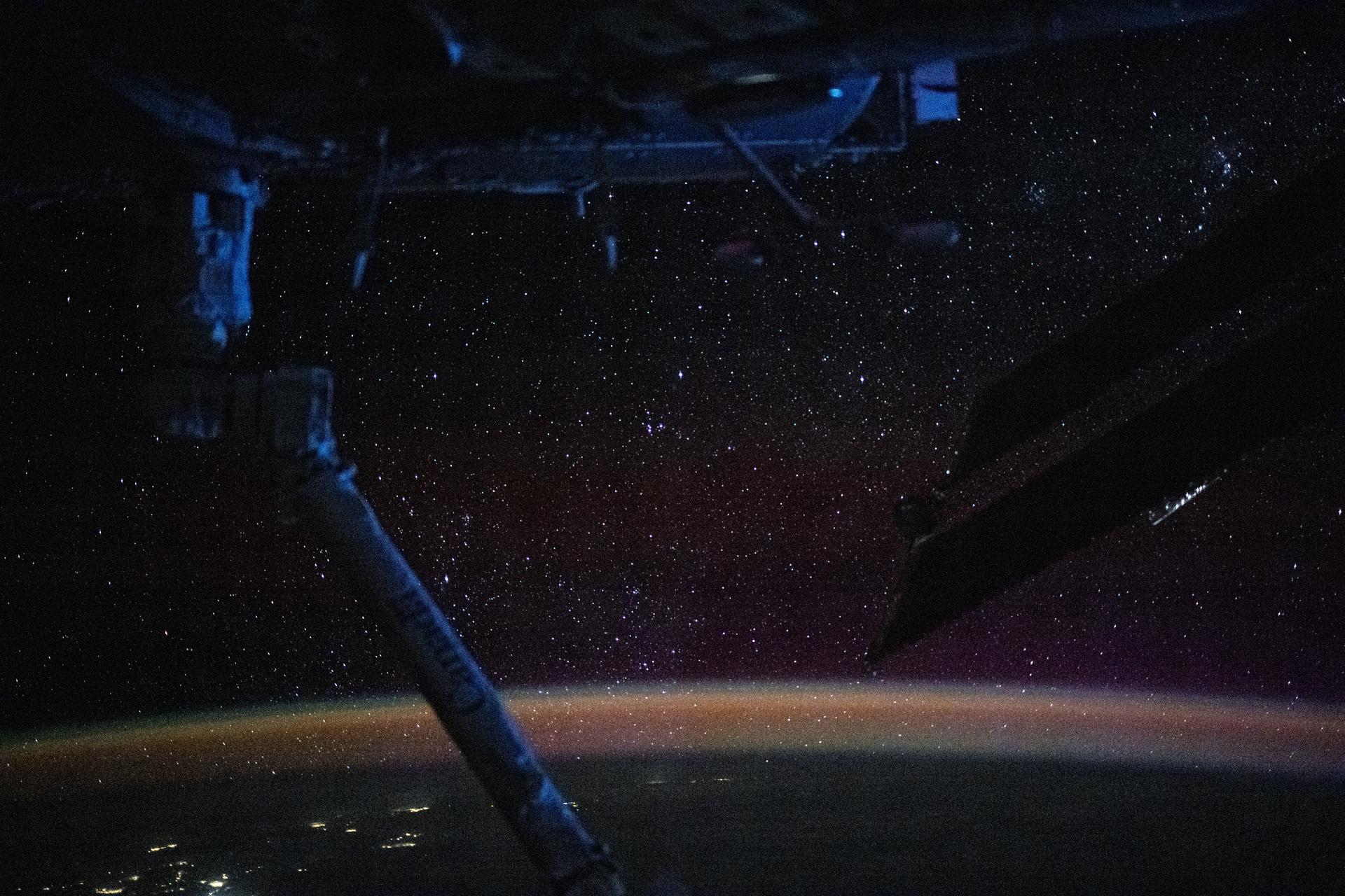 The atmospheric glow, caused by atoms and molecules excited by sunlight, blankets Earth's nighttime horizon with a sparkling field of stars above in this photograph from the International Space Station as it orbited 270 miles above the Pacific Ocean north of Auckland, New Zealand.