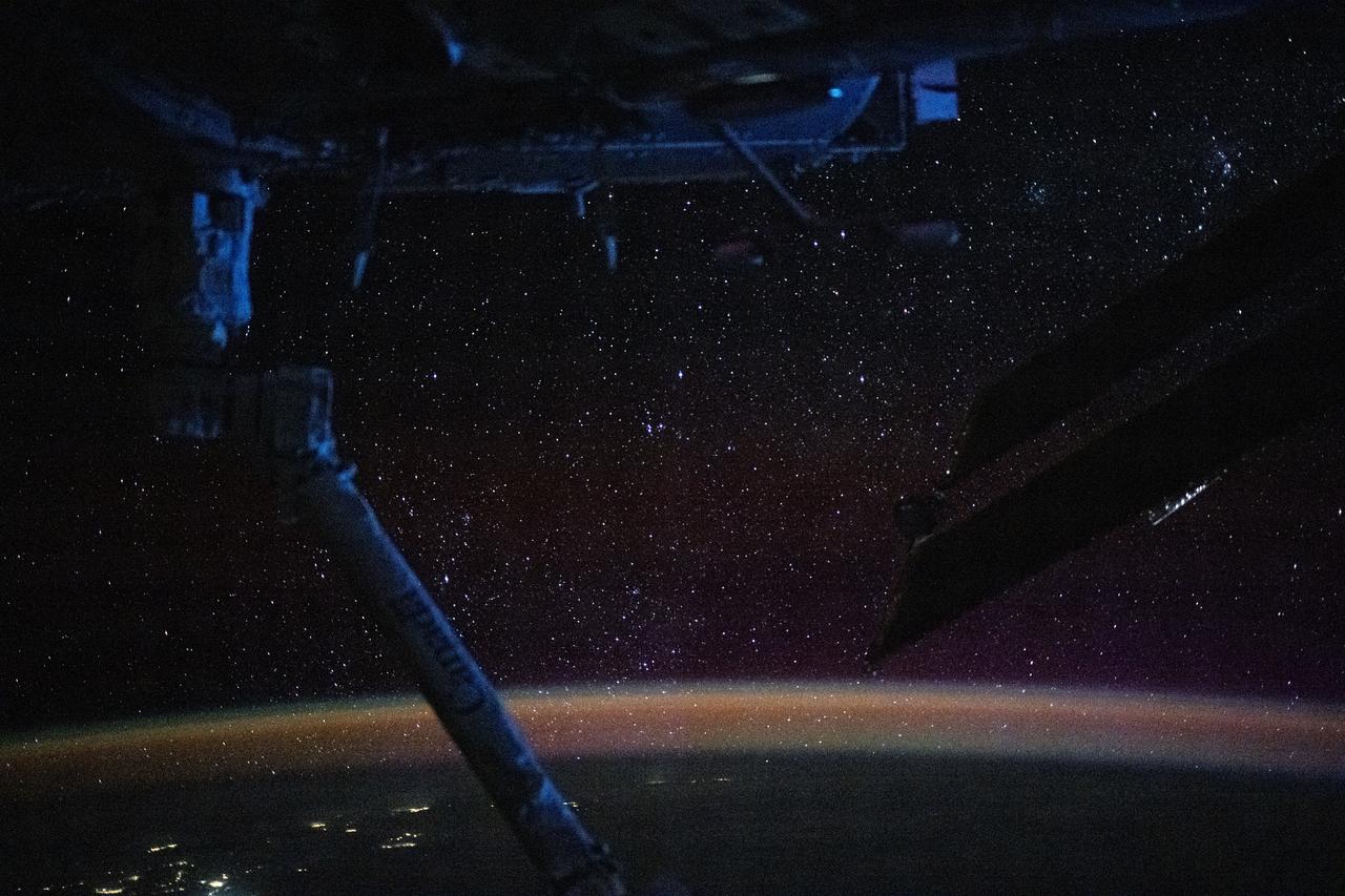 iss072e030147 (Oct. 7, 2024) --- The atmospheric glow, caused by atoms and moelcules excited by sunlight, blankets Earth's nighttime horizon with a sparkling field of stars above in this photograph from the International Space Station as it orbited 270 miles above the Pacific Ocean north of Auckland, New Zealand.