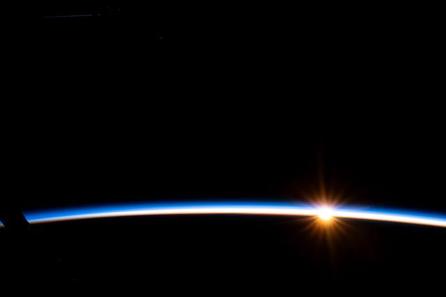 NASA image: The first rays of an orbital sunrise illuminate Earth's atmosphere