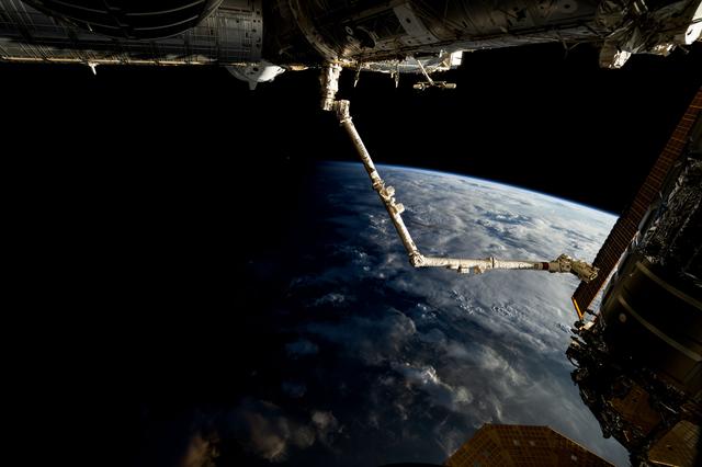NASA image: The 57.7-foot-long Candarm2 robotic arm extends from the Harmony module