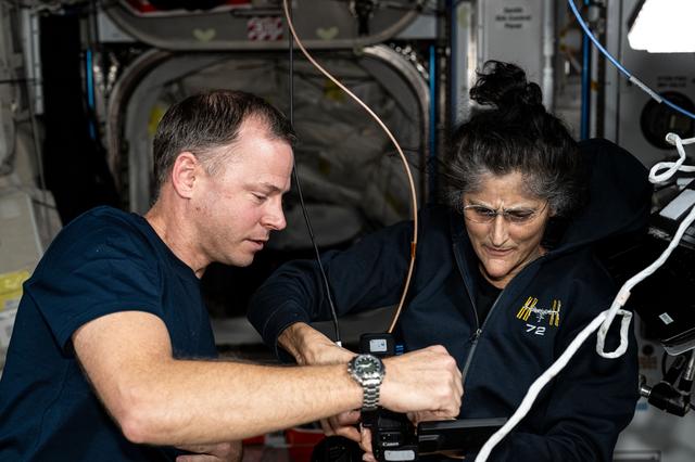 NASA image: Astronauts Nick Hague and Suni Williams discuss orbital lab maintenance procedures