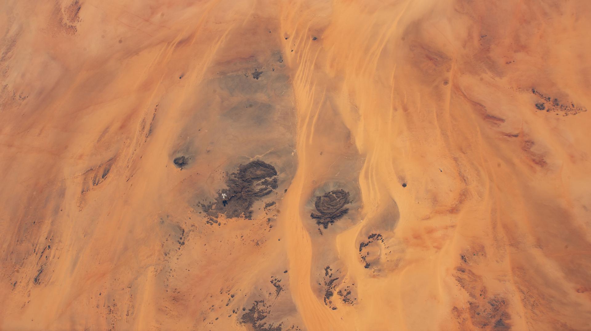 The borders of three African nations, Libya, Sudan, and Egypt, meet in the eastern portion of the Sahara in this photograph from the International Space Station as it orbited 258 miles above.