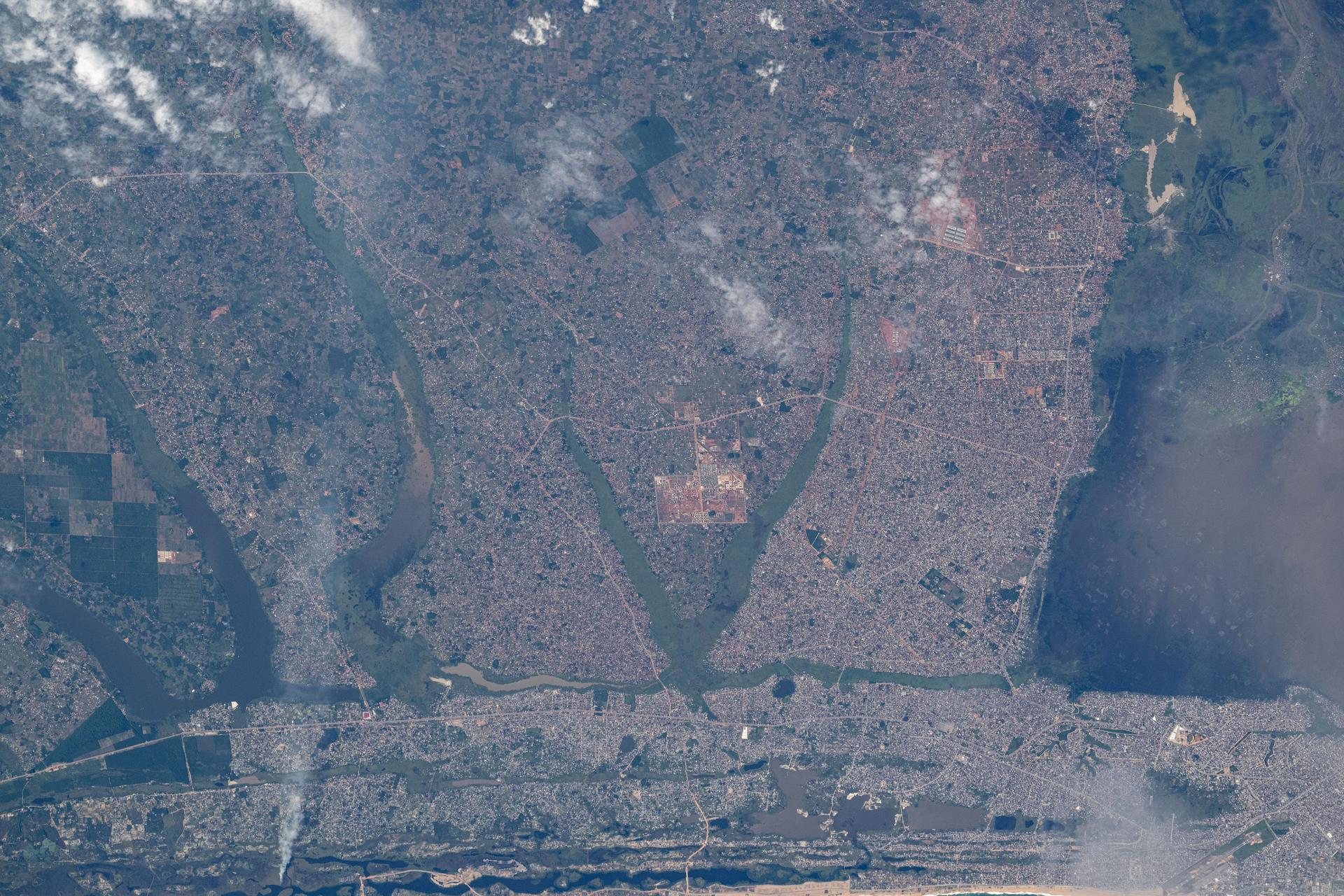 Godomey, Benin, with a population of over 250,000, and surrounding towns on the Gulf of Guinea coast, sits next to Lake Nokoué (right) in this photograph from the International Space Station as it orbited 260 miles above the African continent.