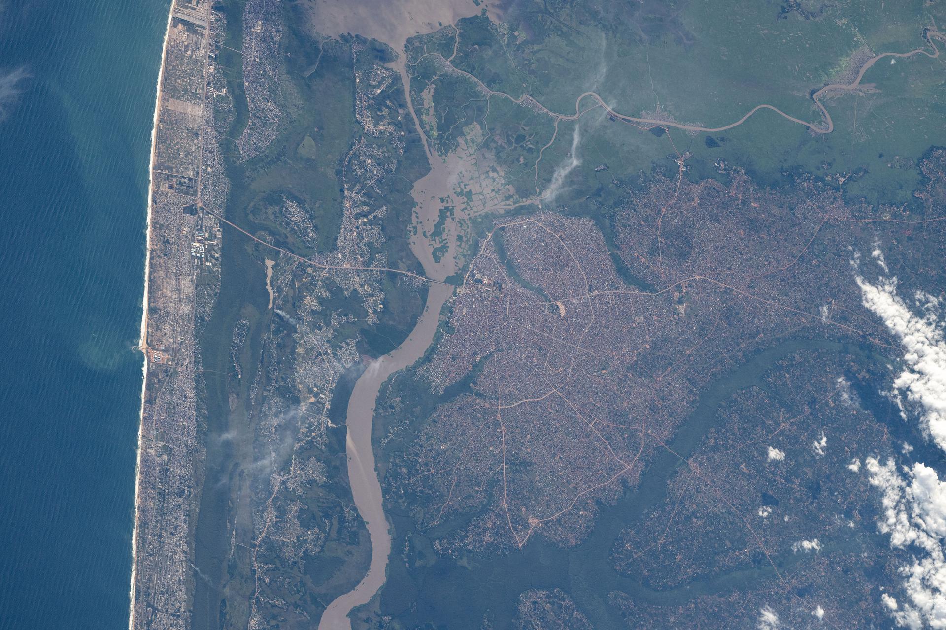 Porto-Novo, the capital of Benin with a population of over 260,000, is situated on the Yewa River next to the coast of the Gulf of Guinea in this photograph from the International Space Station as it orbited 260 miles above.