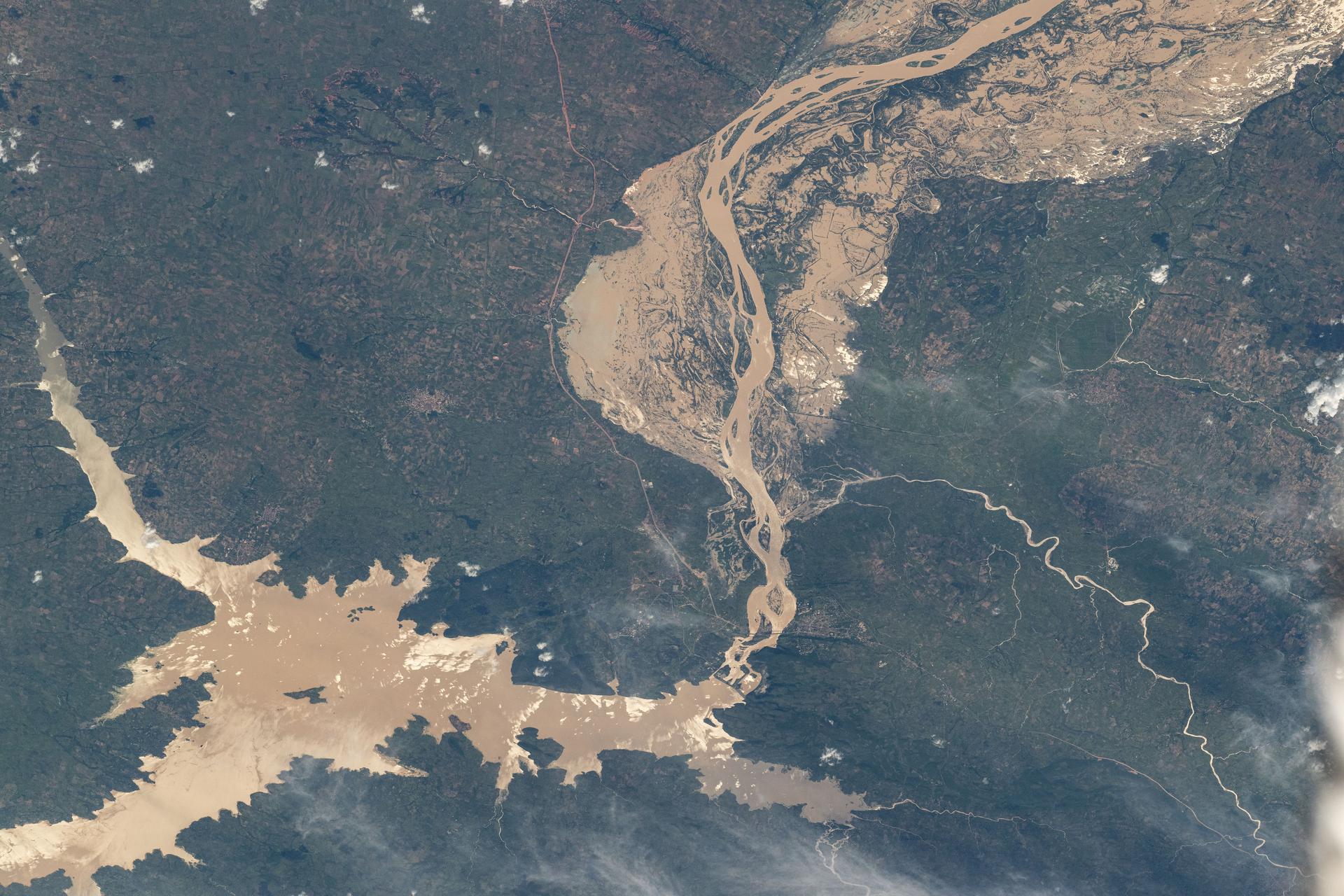 The Jebba Dam (lower left) impounds the Niger River creating a reservoir in Nigeria in this photograph from the International Space Station as it orbited 259 miles above the African nation.
