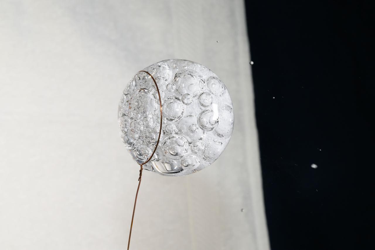 iss072e069828 (Oct. 19, 2024) --- A sphere of water fizzes after an antacid pill was placed inside by NASA astronaut and Expedition 72 Flight Engineer Don Pettit in the microgravity environment of the International Space Station.