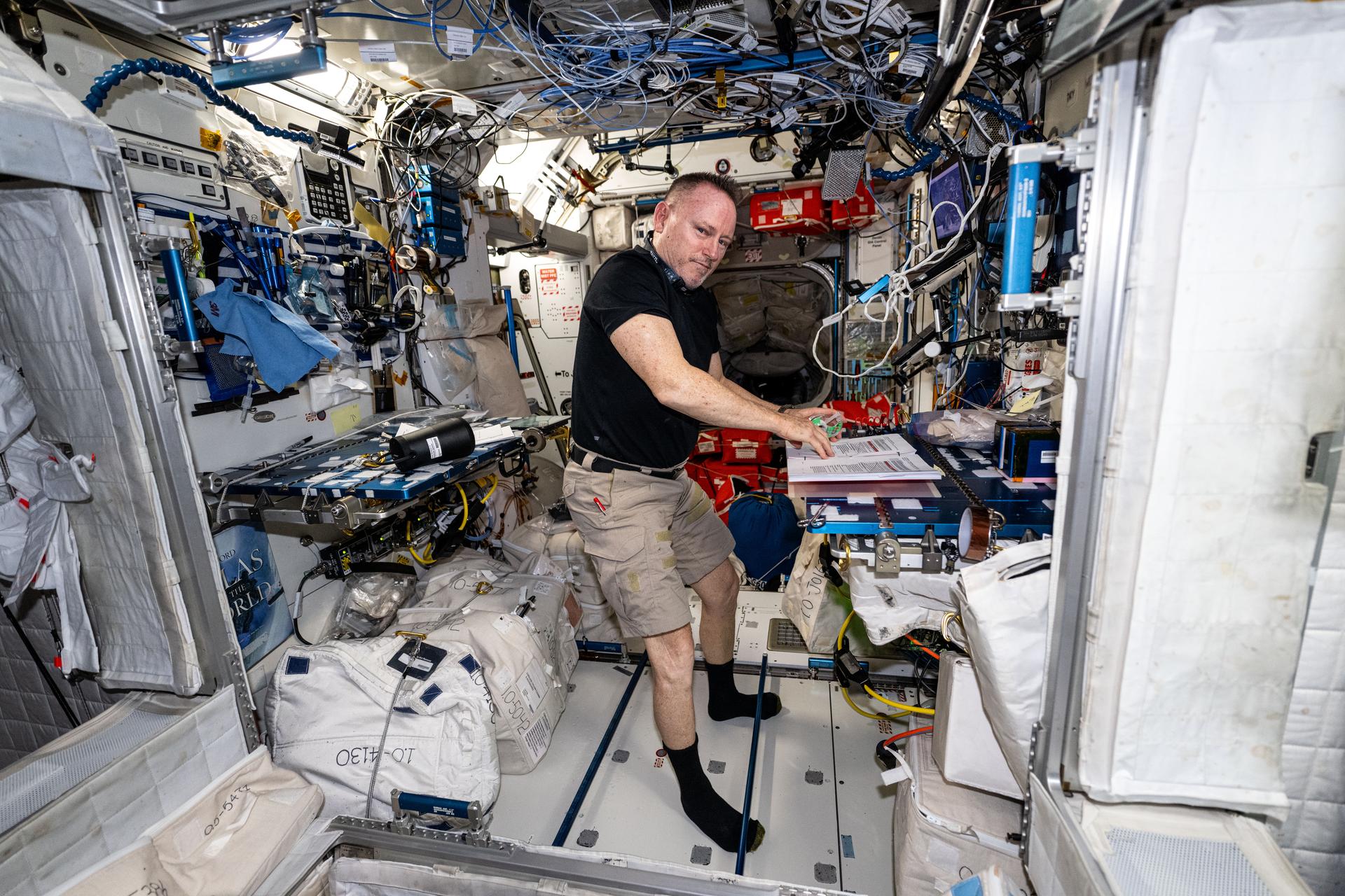 NASA astronaut and Expedition 72 Flight Engineer Butch Wilmore works in the Harmony module printing and updating International Space Station emergency procedures.