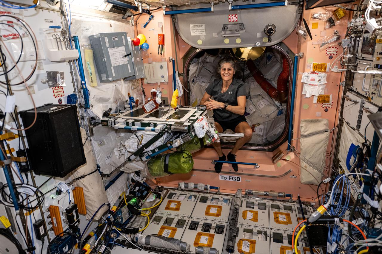 iss072e099560 (Oct. 25, 2024) --- NASA astronaut and Expedition 72 Commander Suni Williams is pictured at the galley inside the International Space Station's Unity module at the beginning of her day.