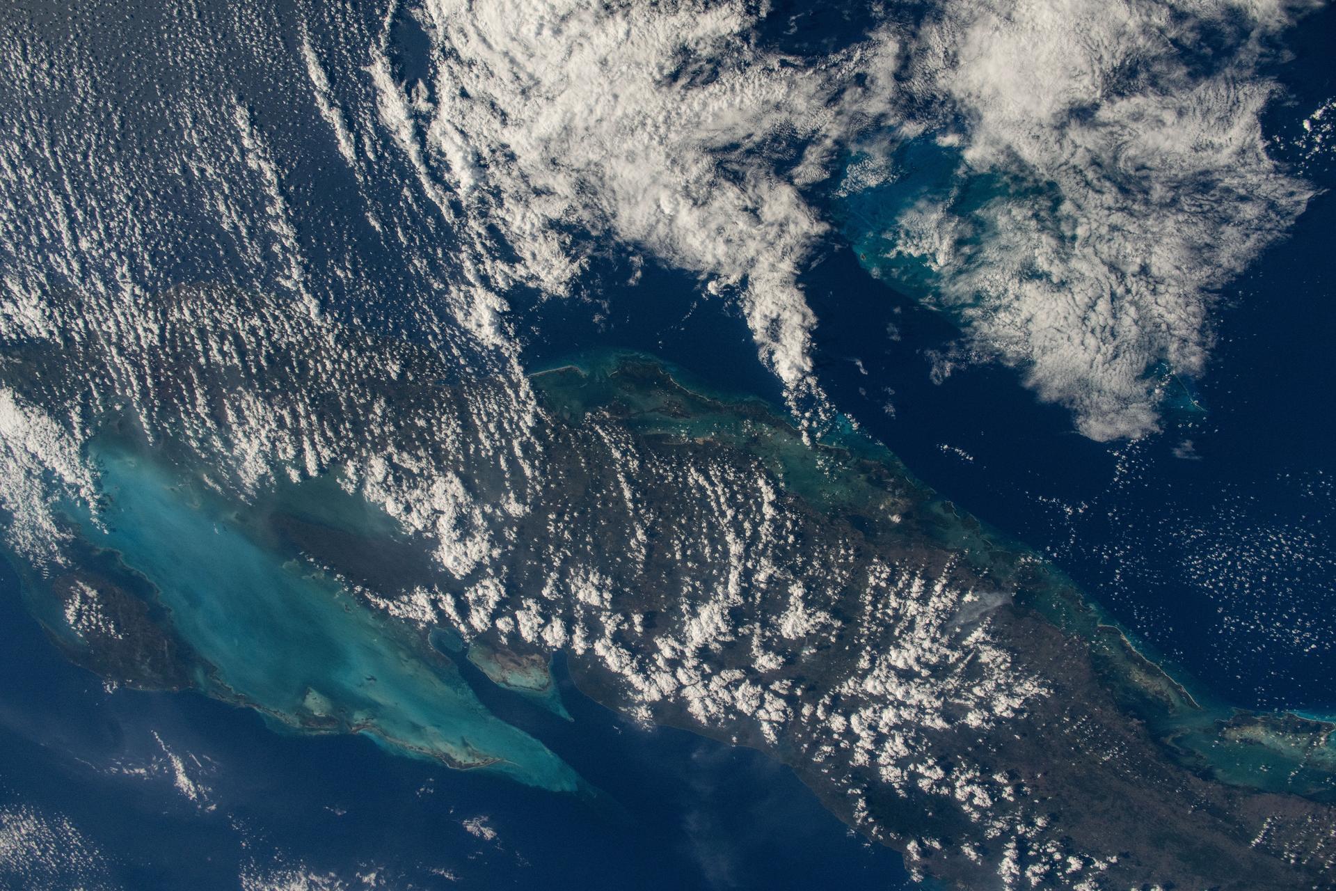 This is the one-millionth image taken during the Expedition 72 mission aboard the International Space Station. The clouds covering the island nation of Cuba hide its capital and largest city Havana (far left) on the Florida Strait. To the south are the marshlands and forests of Cuba's Zapata Swamp that leads to the Caribbean Sea. NASA astronaut and Expedition 72 Flight Engineer Nichole Ayers took this photograph from the International Space Station as it orbited 261 miles above the Bahamas.