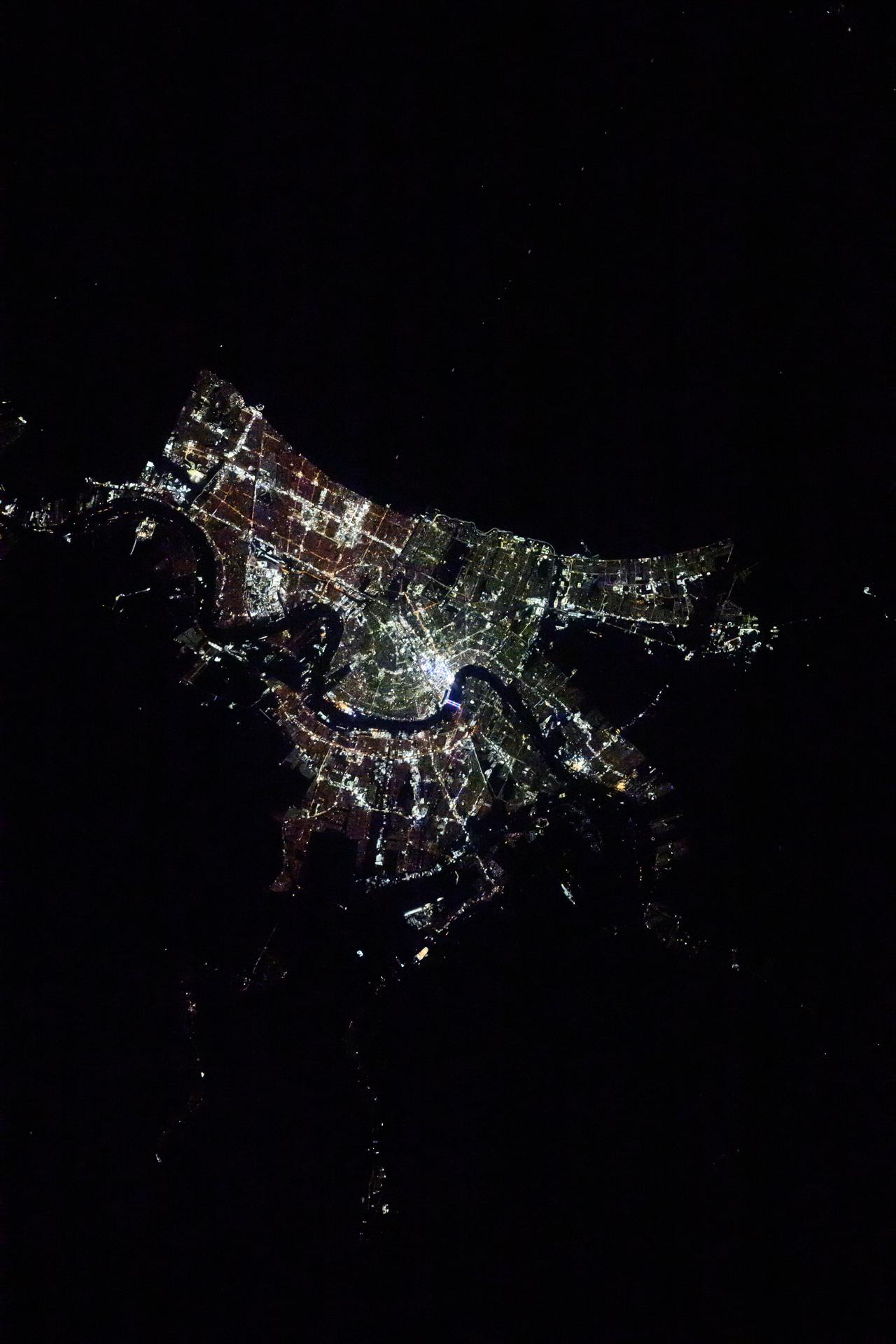 The city lights of New Orleans, Louisiana, and its suburbs along the Mississippi River and on the shoreline of Lake Pontchartrain are pictured at approximately 1:16 a.m. local time from the International Space Station as it orbited 258 miles above.