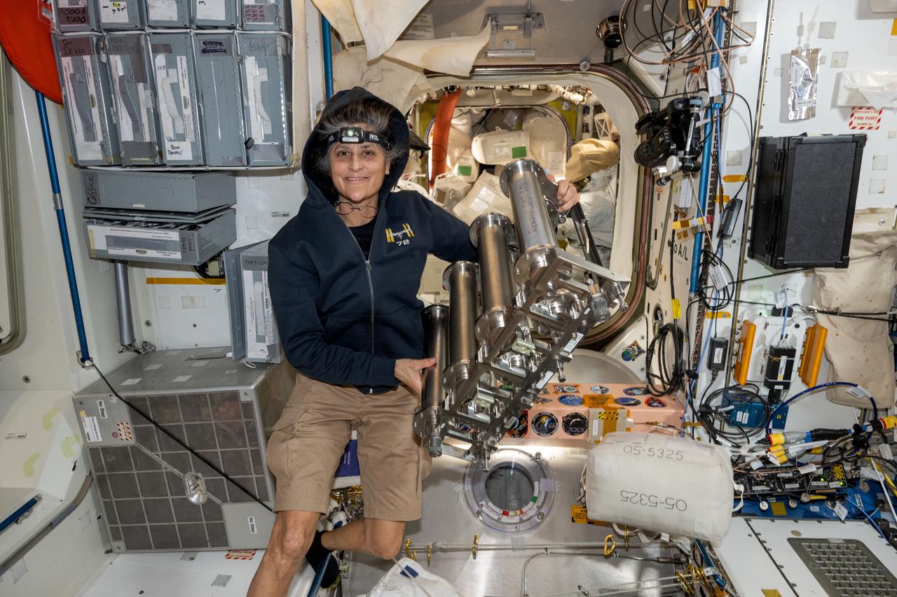 iss072e143163 (Nov. 1, 2024) --- NASA astronaut and Expedition 72 Commander Suni Williams replaces particulate filters on the water recovery system, a component of the Tranquility module's waste and hygiene compartment, the International Space Station's bathroom.