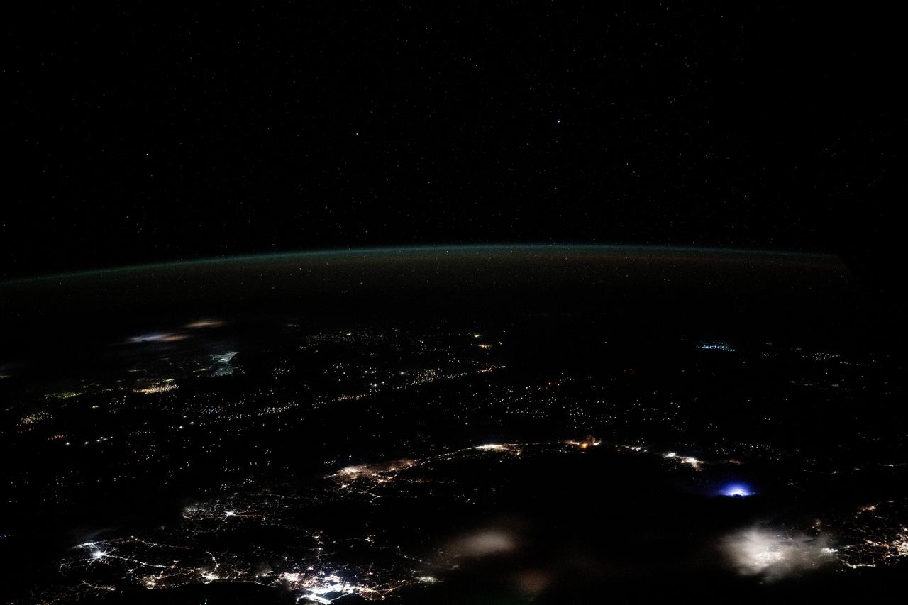iss072e143370 (Nov. 1, 2024) --- Earth's dim atmopsheric glow blankets the Gulf of Thailand dotted with the lights of fishing boats in this orbital nighttime photograph from the International Space Station as it soared 259 miles above.