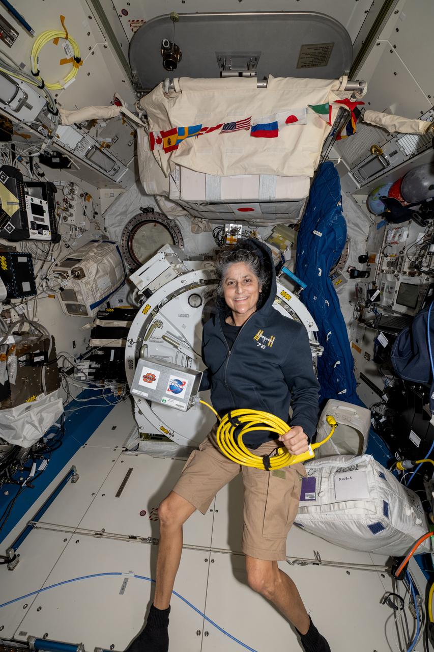 iss072e143491 (Nov. 1, 2024) --- NASA astronaut and Expedition 72 Commander Suni Williams displays the Space Tissue Equivalent Dosimeter (SpaceTED) hardware inside the International Space Station's Kibo laboratory module. SpaceTED is a technology demonstration that can measure radiation dosages and characterize the radiaton environment in microgravity to protect crew members and spacecraft hardware.