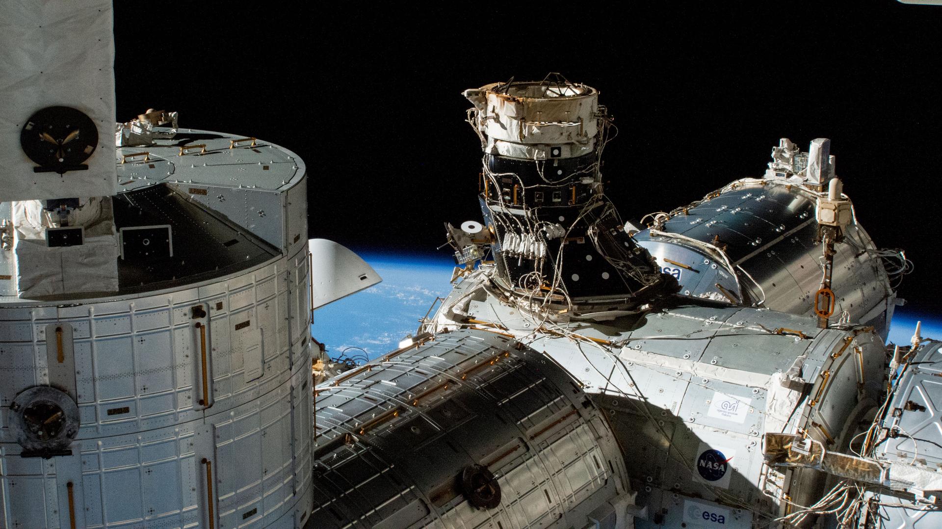 The unoccupied space-facing port on the International Space Station's Harmony module is pictured several hours before the SpaceX Dragon Freedom spacecraft would relocate there after undocking from Harmony's forward port.