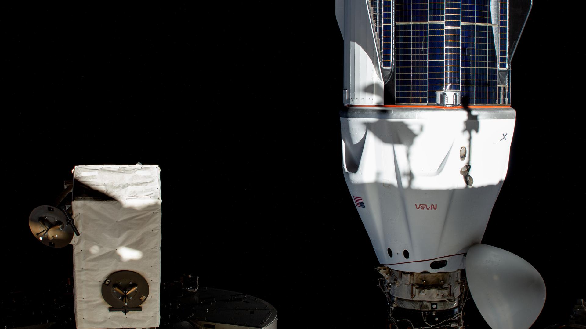 The SpaceX Dragon Freedom spacecraft is pictured docked to the space-facing port on the International Space Station's Harmony module.