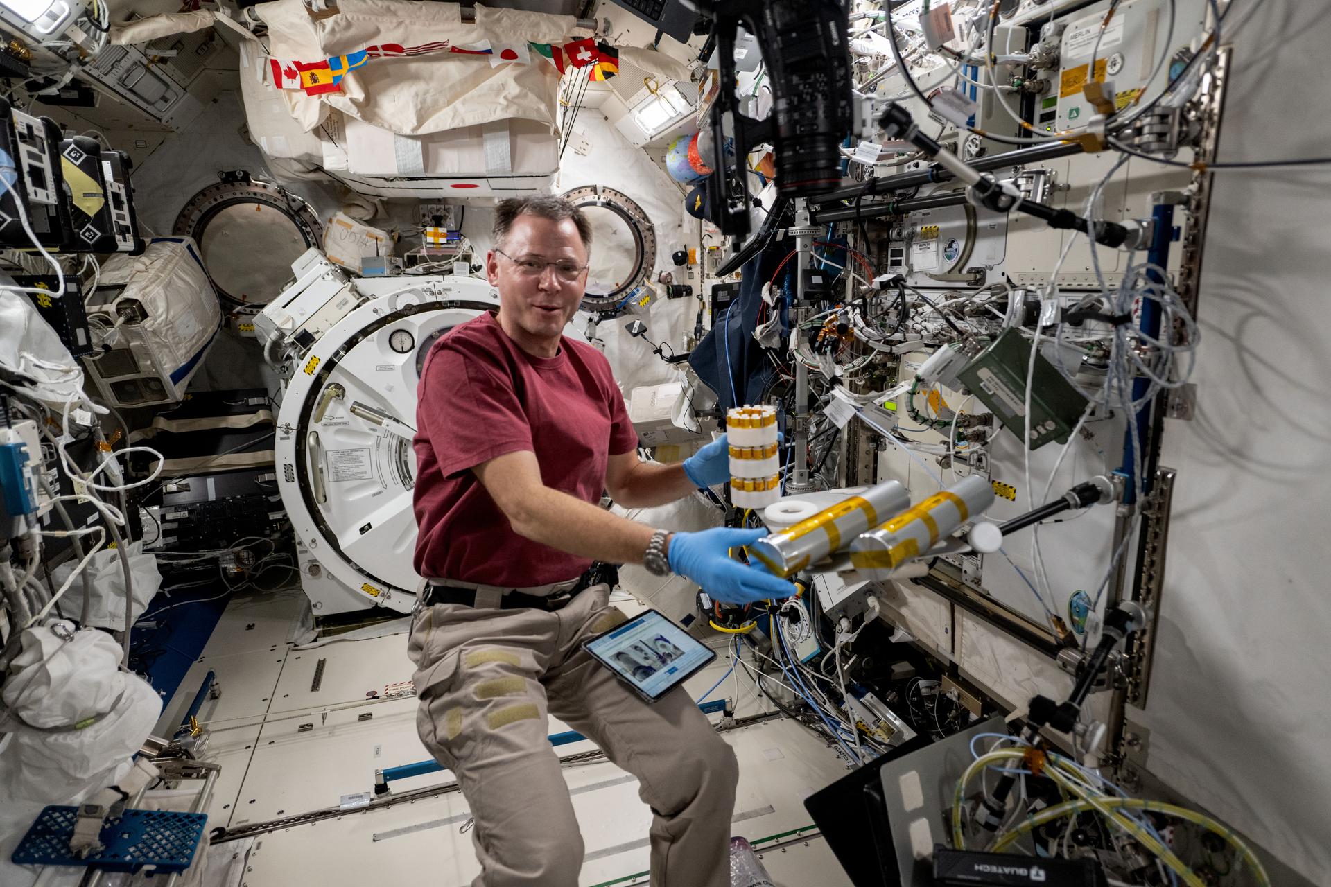 NASA astronaut and Expedition 72 Flight Engineer Nick Hague works inside the International Space Station's Kibo laboratory module on space biology research. Hague was exploring the potential of biomanufacturing using microorganisms and cell cultures to create food, medicine, and more in the microgravity environment reducing the need for cargo missions launched from Earth and promoting crew self-sufficiency during long-term missions.