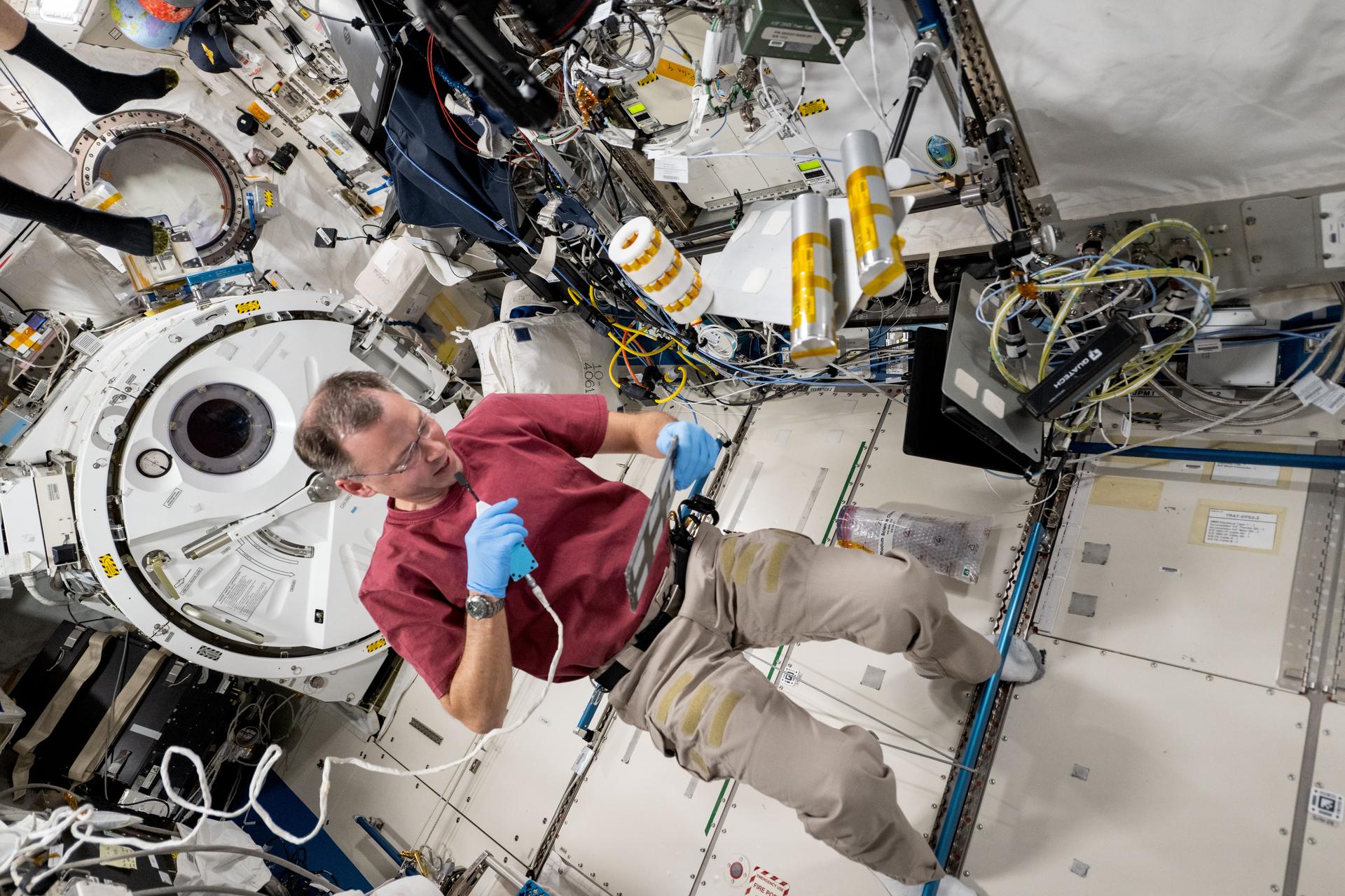 NASA astronaut and Expedition 72 Flight Engineer Nick Hague works inside the International Space Station's Kibo laboratory module on space biology research. Hague was exploring the potential of biomanufacturing using microorganisms and cell cutlures to create food, medicine, and more in the microgravity environment reducing the need for cargo missions launched from Earth and promoting crew self-sufficiency during long-term missions.