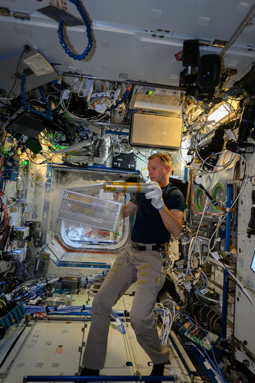 iss072e146896 (Nov. 10, 2024) --- NASA astronaut and Expedition 72 Flight Engineer Nick Hague processes samples from the Rhodium Biomanufacturing-03 biotechnology experiment that explores using microorganisms and cell cultures to produce materials and biomolecules on a commercial scale in space.