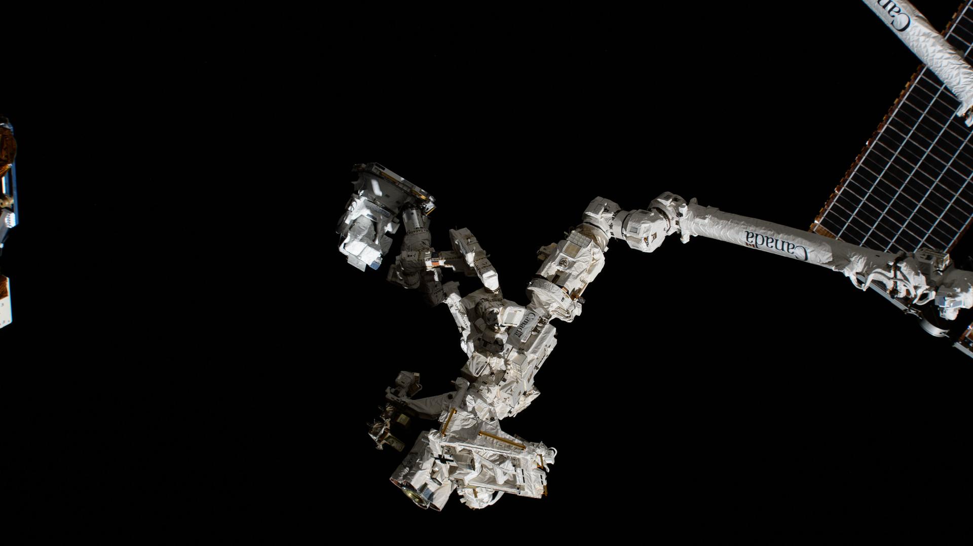 The fine-tuned robotic hand, better known as Dextre, is attached to the Canadarm2 robotic arm and carries the CODEX experiment (center) after extracting the research hardware from the trunk of the SpaceX Dragon cargo spacecraft. CODEX, a solar coronagraph installed on the International Space Station, will gather important information about the solar wind and how it forms. A coronagraph blocks out the bright light from the Sun to better see details in the Sun's outer atmosphere, or corona.