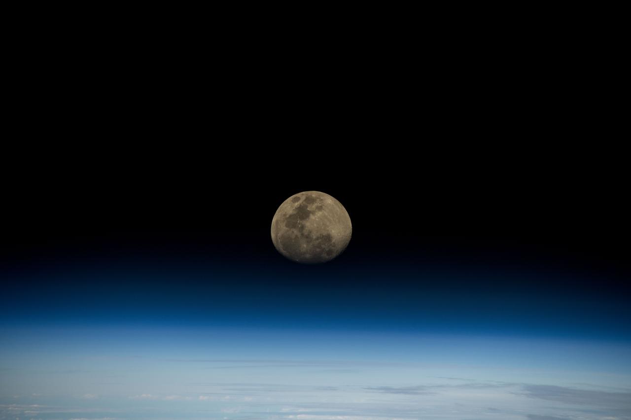 iss072e186870 (Nov. 13, 2024) -- A waxing gibbous moon rises over the blue glow of Earth's horizon as the International Space Station orbited 264 miles above the Indian Ocean.