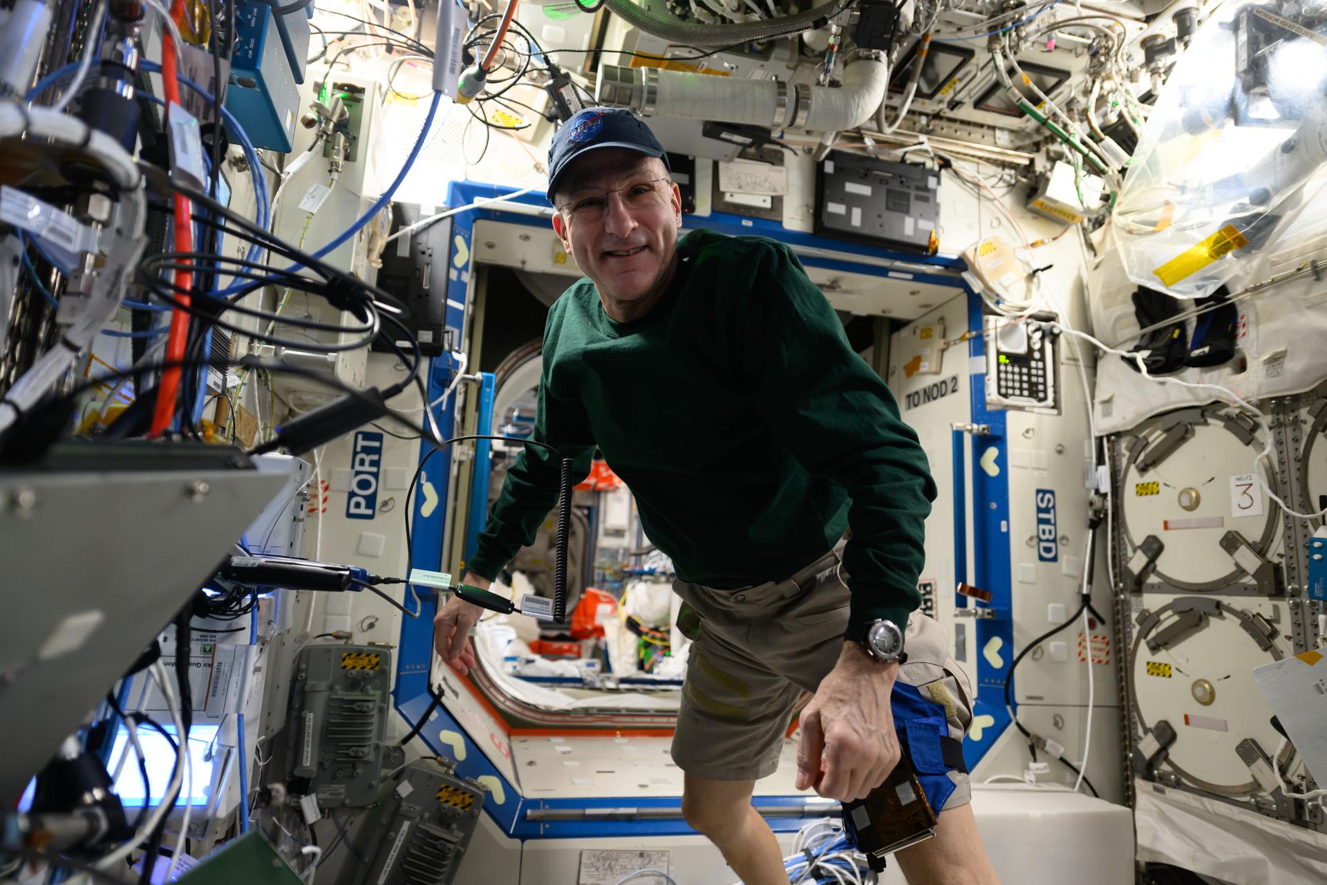 NASA astronaut and Expedition 72 Flight Engineer Don Pettit takes a break and poses for a portrait aboard the International Space Station's Destiny laboratory module.