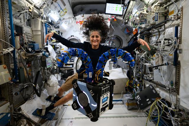 NASA image: Astronaut Suni Williams checks out the Astrobee robotic free-flyer