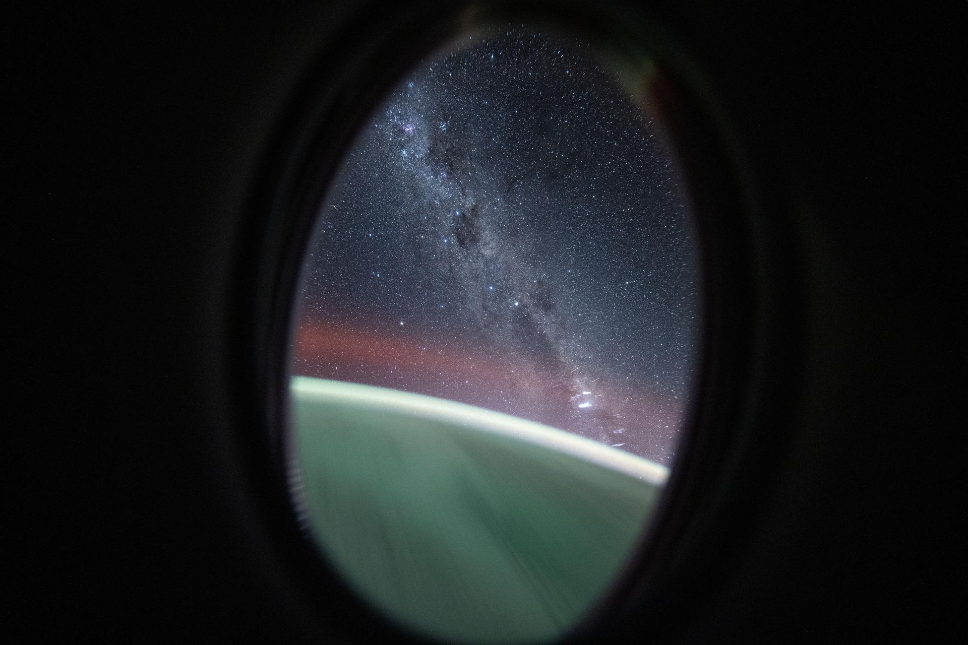 This long-duration photograph looks out a window on the SpaceX Dragon crew spacecraft to the Milky Way as the International Space Station orbited 262 miles above the Pacific Ocean northeast of New Zealand.