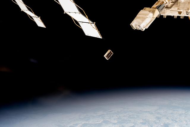 NASA image: A CubeSat is ejected into Earth orbit from a small satellite orbital deployer