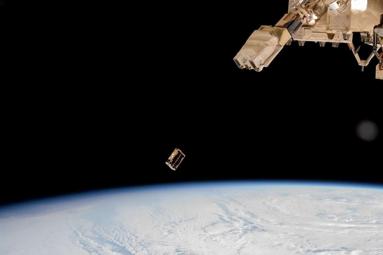 iss072e352225 (Dec. 9, 2024) --- A CubeSat is ejected into Earth orbit from a small satellite orbital deployer attached to the International Space Station's Kibo laboratory module. A series of CubeSats were deployed into Earth orbit on Dec. 9, 2024, for educational research missions designed by Japanese high school and college students. Credit: NASA/Butch Wilmore