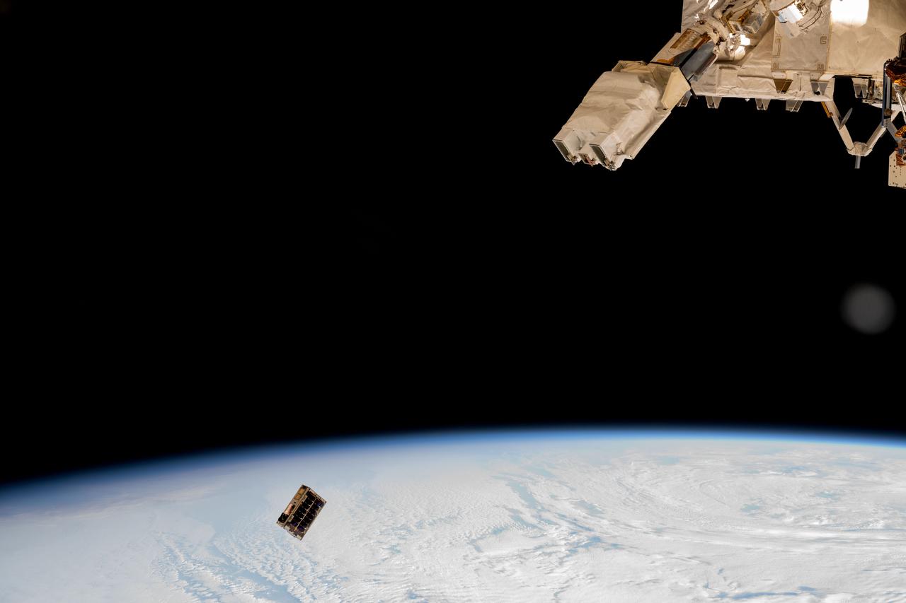 iss072e352275 (Dec. 9, 2024) --- A CubeSat is ejected into Earth orbit from a small satellite orbital deployer attached to the International Space Station's Kibo laboratory module. A series of CubeSats were deployed into Earth orbit on Dec. 9, 2024, for educational research missions designed by Japanese high school and college students. Credit: NASA/Butch Wilmore