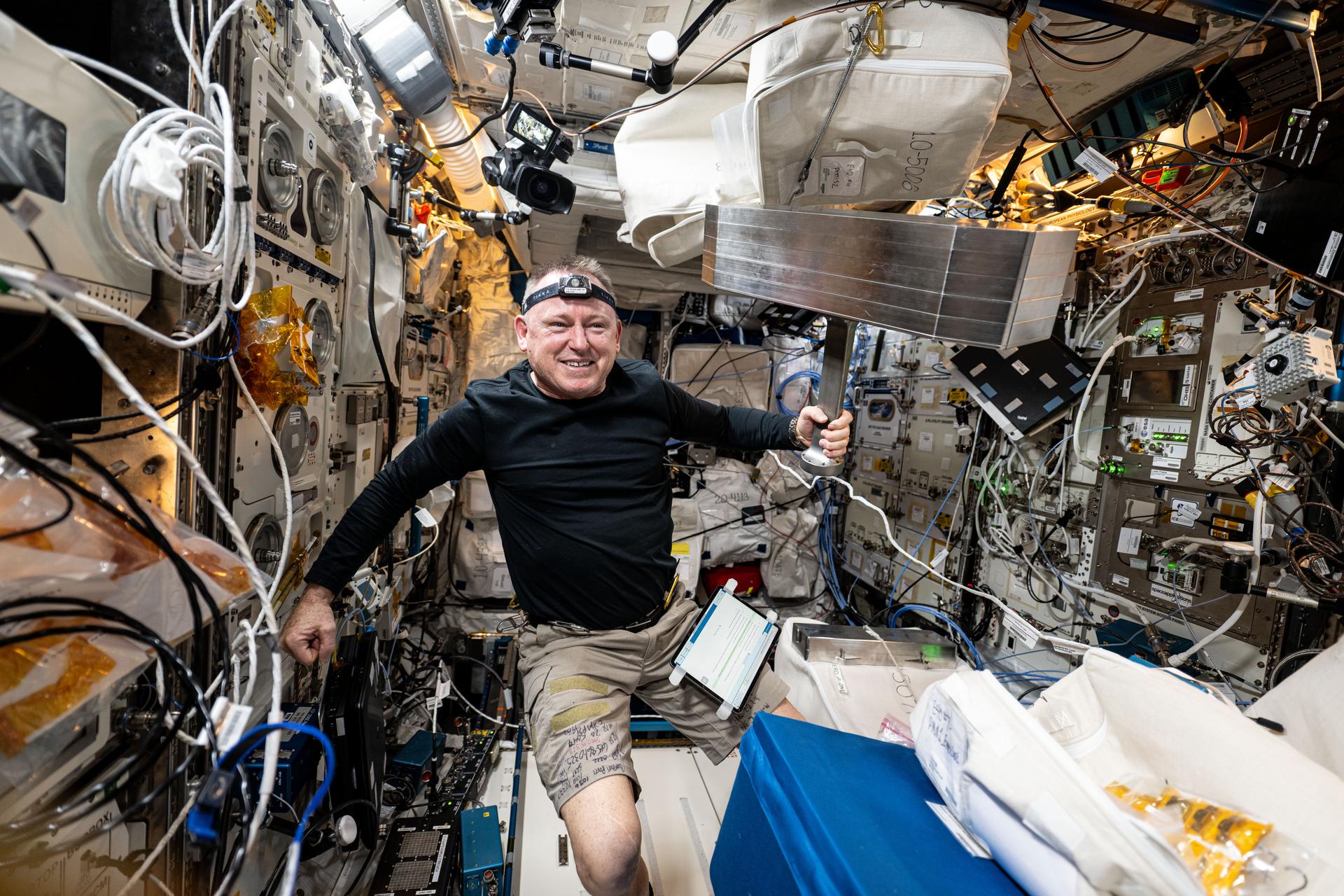 NASA astronaut and Expedition 72 Flight Engineer Butch Wilmore works inside the International Space Station's Columbus laboratory module to begin installing the European Enhanced Exploration Exercise Device. The futuristic exercise gear will be tested by the station crew using its advanced bicycling, rowing, and resistive capabilities. The small and compact workout gear will be evaluated in the orbital outpost’s microgravity environment before being used on longer term missions to the Moon, Mars, and beyond.