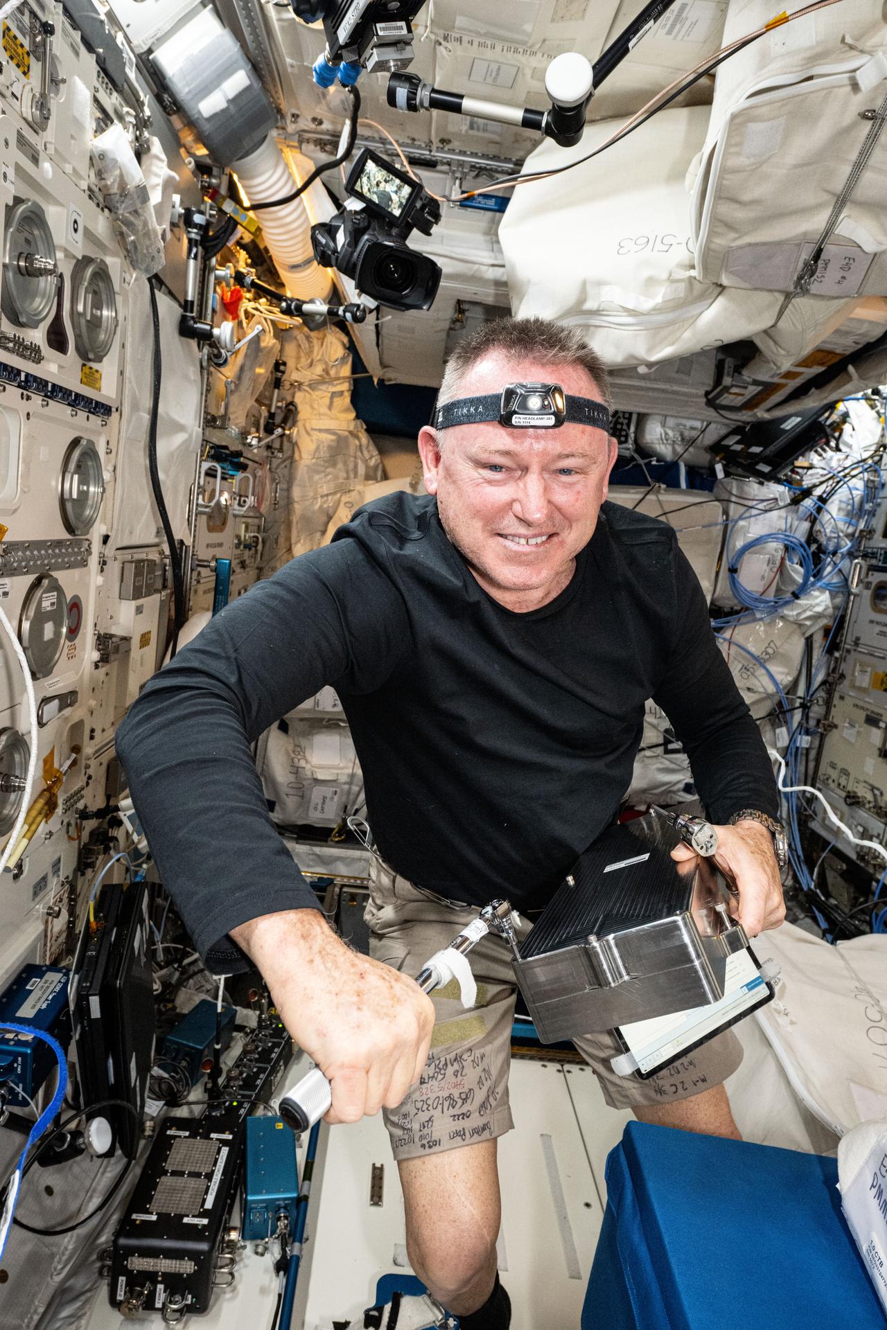 NASA astronaut and Expedition 72 Flight Engineer Butch Wilmore works inside the International Space Station's Columbus laboratory module to begin installing the European Enhanced Exploration Exercise Device. The futuristic exercise gear will be tested by the station crew using its advanced bicycling, rowing, and resistive capabilities. The small and compact workout gear will be evaluated in the orbital outpost’s microgravity environment before being used on longer term missions to the Moon, Mars, and beyond.