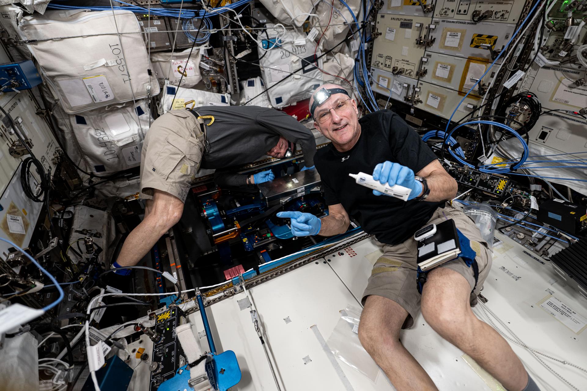 NASA astronauts (from left) Butch Wilmore and Don Pettit, both Expedition 72 flight engineers, install the European Enhanced Exploration Exercise Device inside the International Space Station's Columbus laboratory module. The futuristic exercise gear will be tested by the station crew using its advanced bicycling, rowing, and resistive capabilities. The small and compact workout gear will be evaluated in the orbital outpost’s microgravity environment before being used on longer term missions to the Moon, Mars, and beyond.
