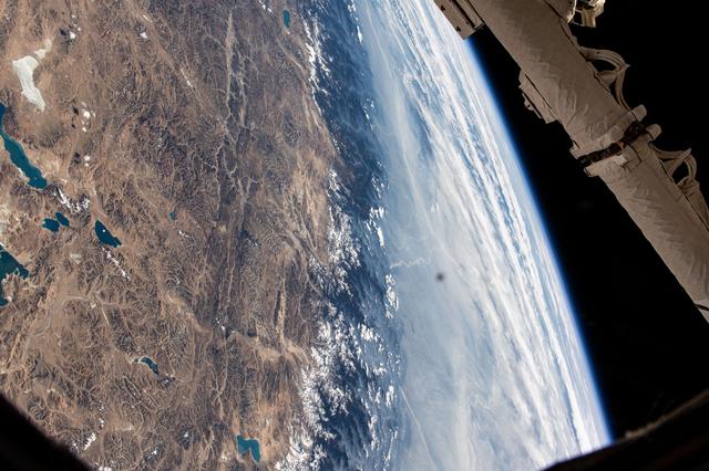 NASA image: The Himalayas separate China from a cloudy India