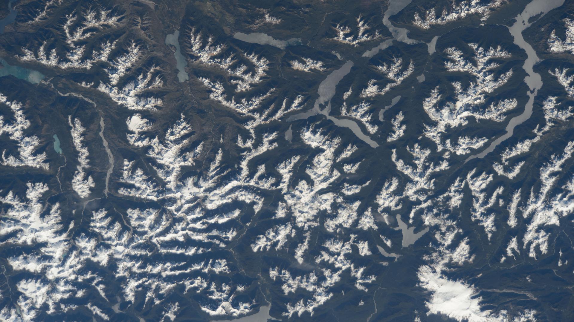The snow-tipped Andes mountain range and its many lakes on the southern border between Chile and Argentina are pictured from the International Space Station as it orbited 268 miles above South America.
