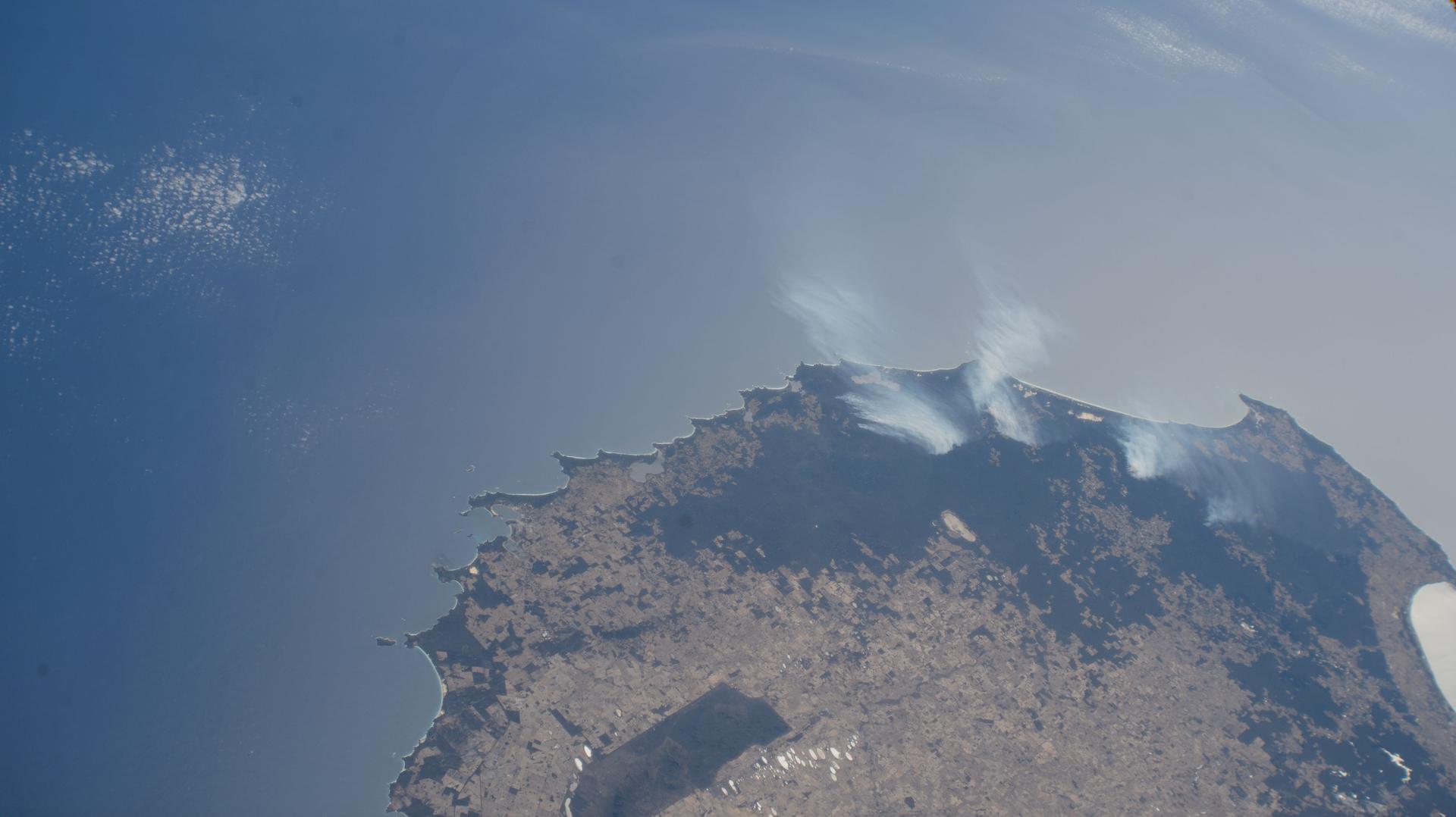 Wildfires are spotted in Mount Frankland National Park about 195 miles south of Perth, Western Australia, in this photograph from the International Space Station as it orbited 266 miles above the island continent.