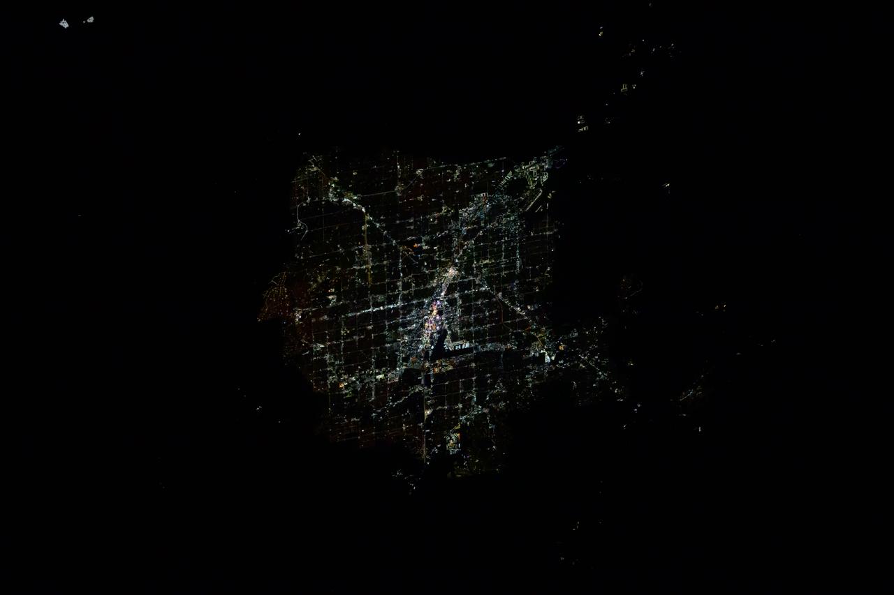 iss072e399146 (Dec. 19, 2024) --- Downtown Las Vegas, Nevada, with its famous well-lit strip and Harry Reid International Airport at center, is pictured at approximately 4:16 a.m. local time from the International Space Station as it orbited 256 miles above.