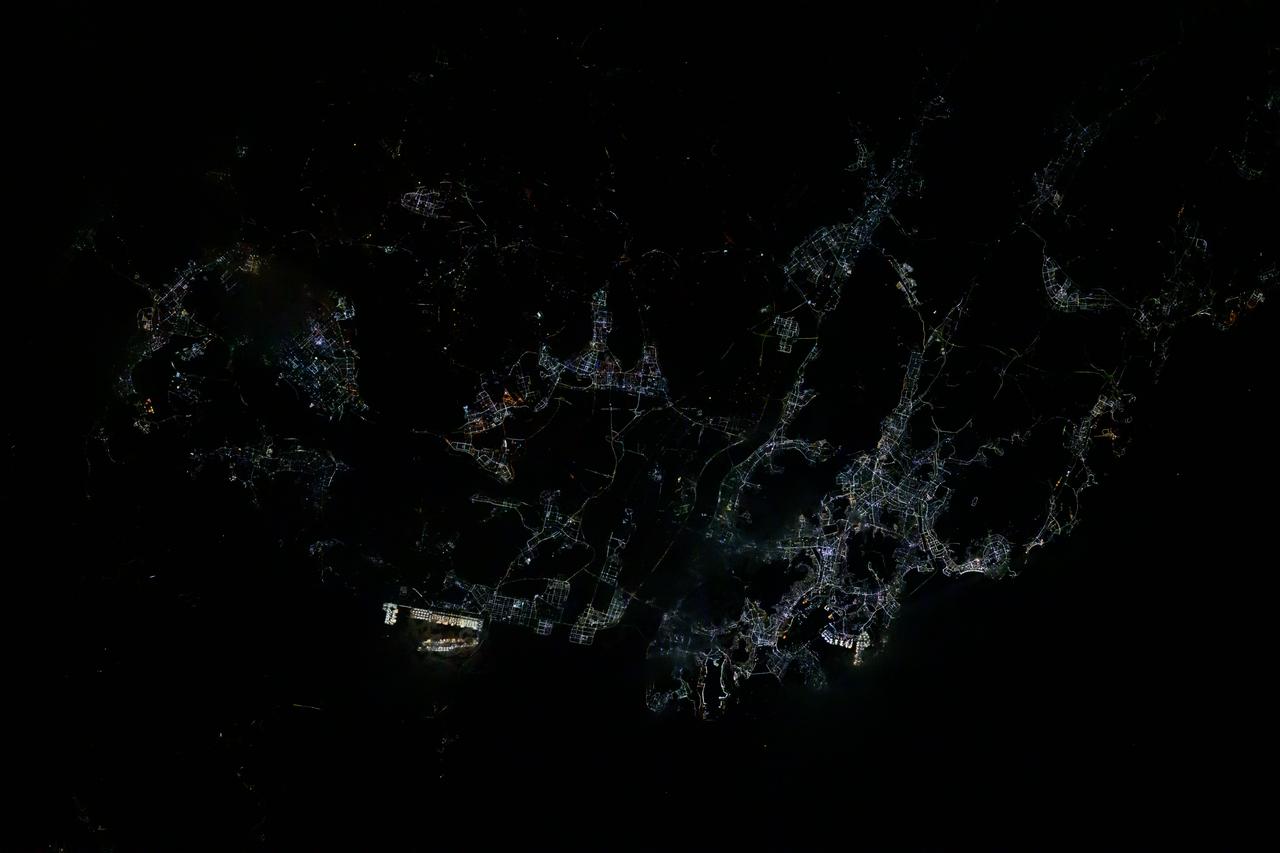 iss072e399852 (Dec. 20, 2024) --- The city lights of Busan, South Korea, a port city with a population of over 3.3 million on the Korean Strait, are pictured at approximately 4:19 a.m. local time from the International Space Station as it orbited 257 miles above.