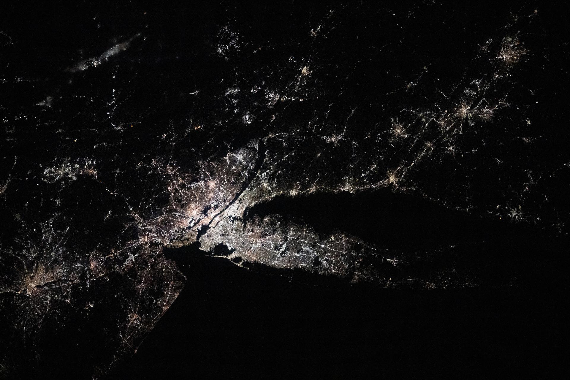 The city lghts of the New York/New Jersey metropolitan area at approximately 3:30 a.m. EST (local time) contrast with the Atlantic coast and the Hudson River in this photograph taken from the International Space Station as it orbited 259 miles above Newfoundland.