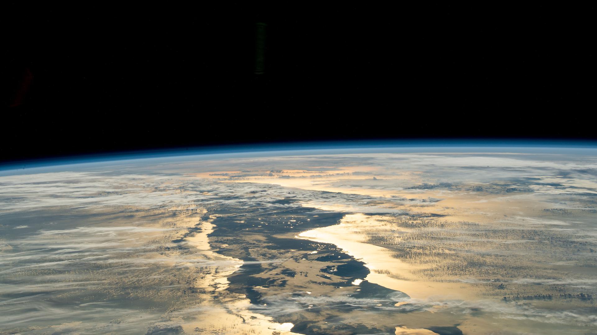 New Year's Day dawns on Cuba as the sunlight gleams off its Atlantic and Caribbean coasts in this photograph from the International Space Station as it orbited 260 miles above the Gulf of Mexico.