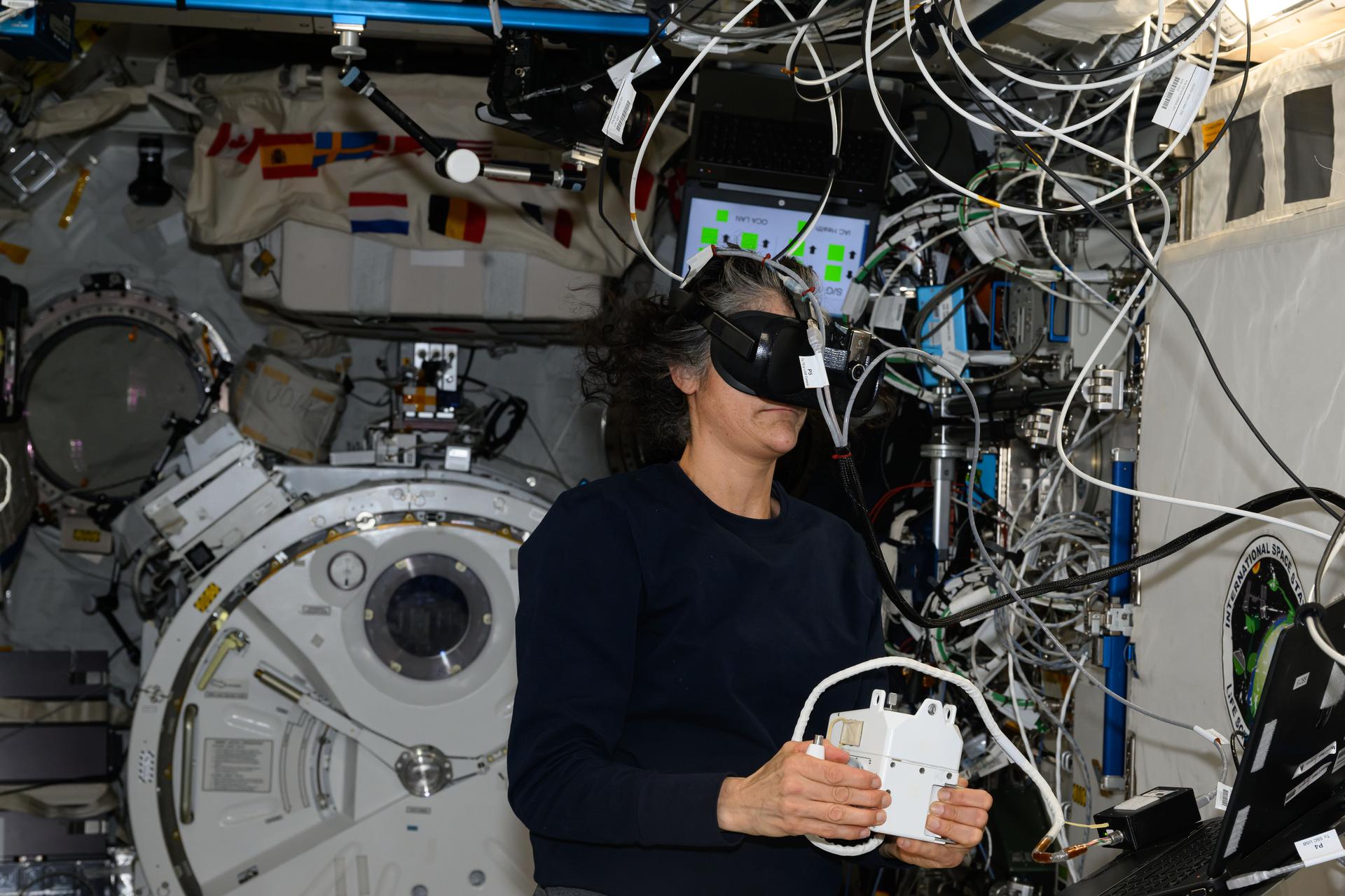 NASA astronaut and Expedition 72 Commander Suni Williams wears a virtual reality headset and practices emergency maneuvers a spacewalker would use in the unlikely event they became untethered from the International Space Station. During spacewalks astronauts wear U.S. spacesuits with a jetpack installed called a SAFER, or Simplified Aid for EVA (Extra Vehicular Activity) Rescue, that contains a controller and thrusters used to guide a crew member back to the safety of the orbital outpost.
