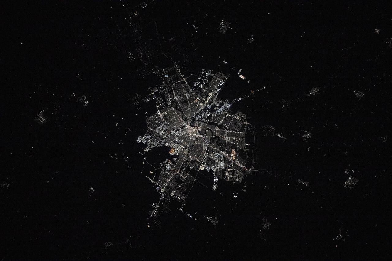 iss072e423413 (Dec. 29, 2024) --- The city lights of Winnipeg in Manitoba, Canada, contrast with the Red River in this photograph taken at approximately 3:04 a.m. local time from the International Space Station as it orbited 261 miles above.