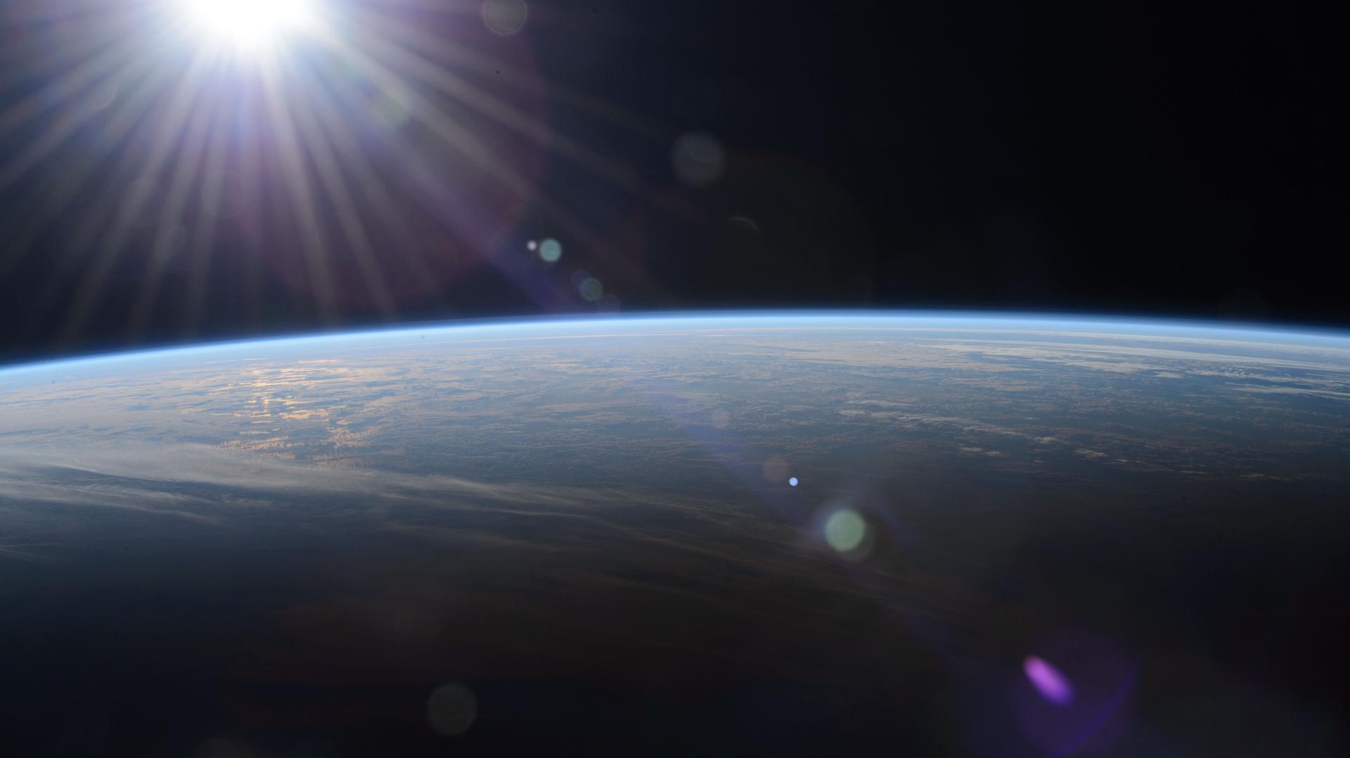 The sun rises above the Pacific Ocean revealing the terminator, the line between night and day on Earth, in this photograph from the Internaional Space Station as it orbited 259 miles above and about 500 miles north of Hawaii.