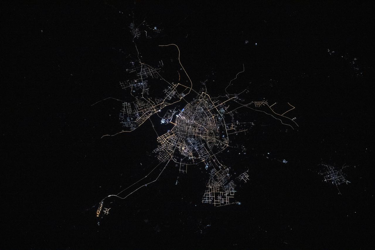 iss072e445027 (Dec. 28, 2024) --- The city lights of Harbin, the capital of China's northernmost province of Heilongjiang with a population of about 10 million and split by the Songhua River, are pictured at approximately 1:33 a.m. local time from the International Space Station.
