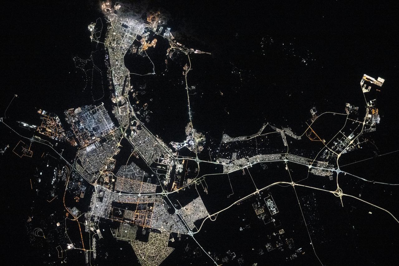 iss072e447461 (Jan. 2, 2025) --- The well-lit island city and capital of United Arab Emirates, Abu Dhabi on the Persian Gulf with a population of about 1.57 million people, is pictured at approximately 10:03 p.m. local time from the International Space Station as it orbited 256 miles above.