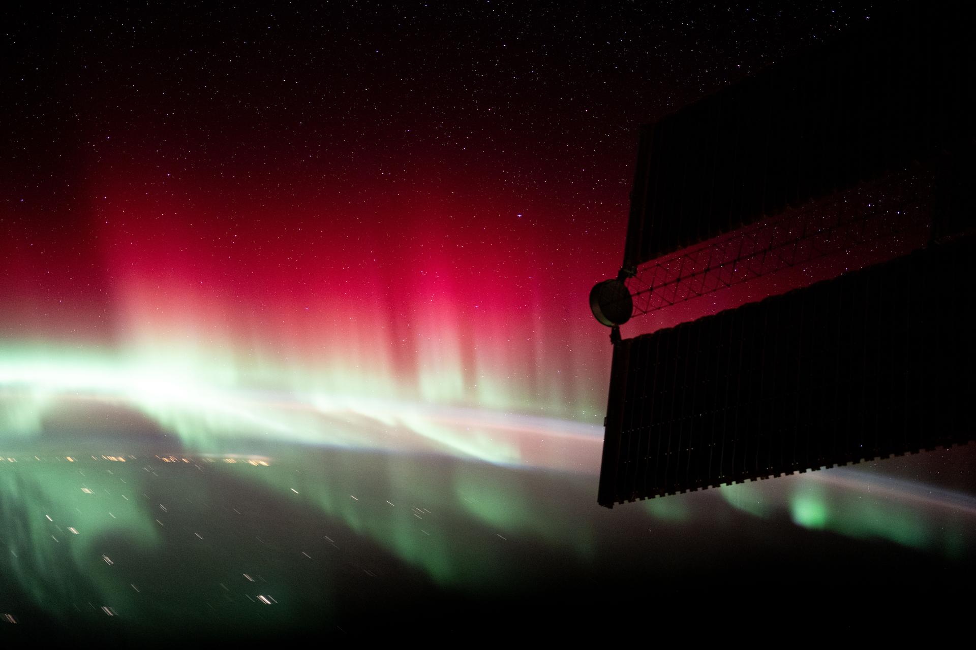 A red and green aurora shimmers brightly above Ontario, Canada, near James Bay in this photograph from the International Space Station as it orbited 260 miles above North America.