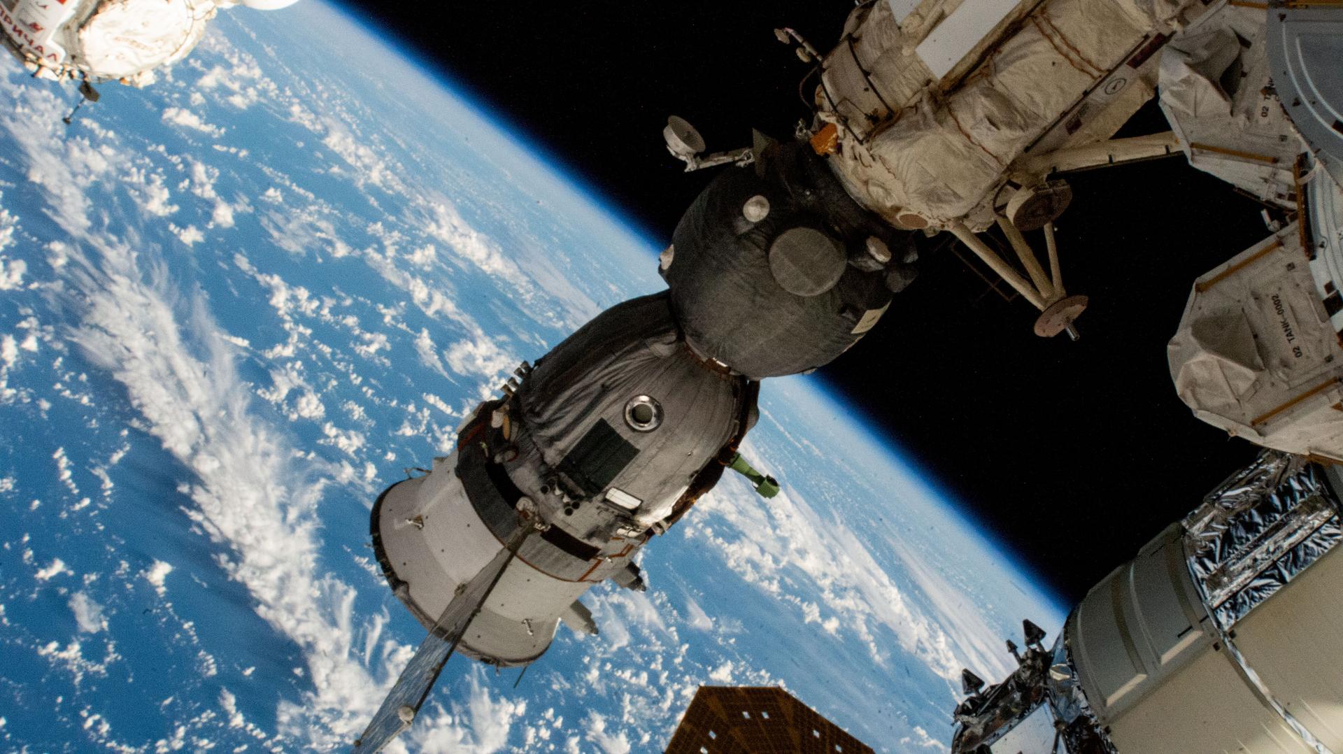 The Soyuz MS-26 crew ship is pictured docked to the Rassvet module as the International Space Station orbited 264 miles above the Pacific Ocean northeast of New Zealand. The Soyuz spacecraft launched NASA astronaut Don Pettit and Roscosmos cosmonauts Alexey Ovchinin and Ivan Vagner to the orbital outpost on Sept. 11, 2024.